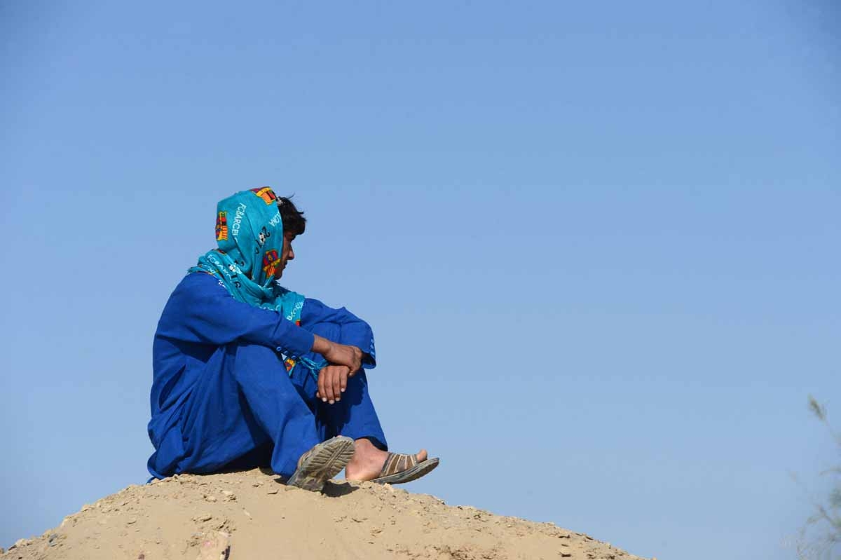 This file photo taken on October 31, 2016 shows an Afghan boy, who was held as a child sex slave, as he sits at a unidentified location in Afghanistan.