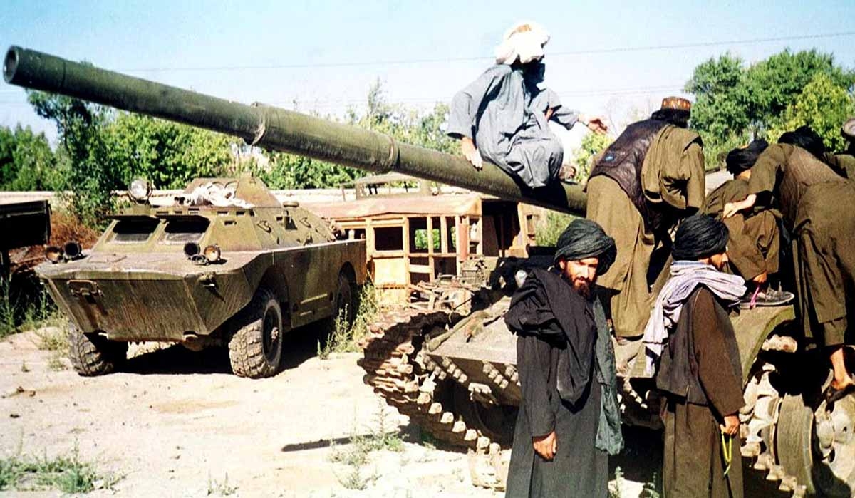 Taliban figthters Tuesday try to repair their broken military tank in the Afghan capital, Kabul, 02 October 2001.