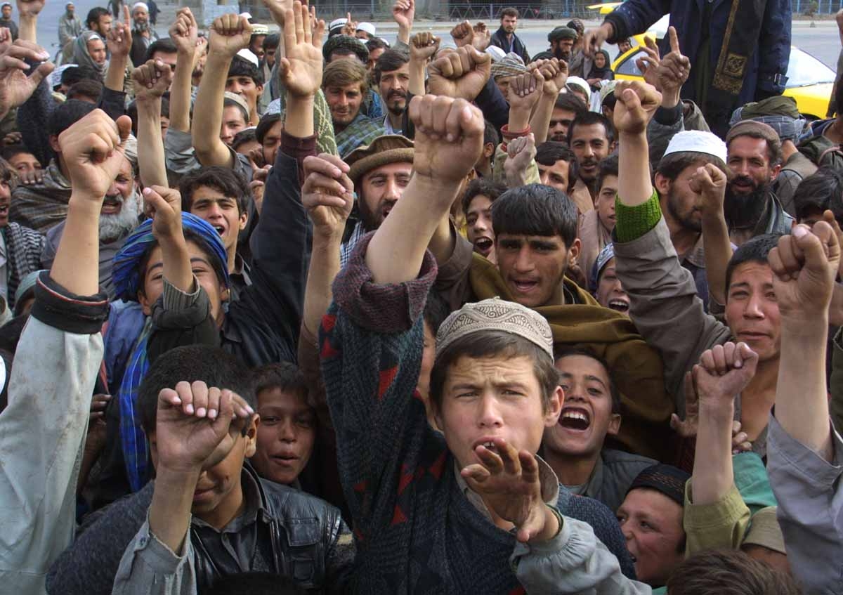 Local residents shout 'Allah Akbar' 13 November 2001 in Kabul, after Northern Alliance captured the capital.