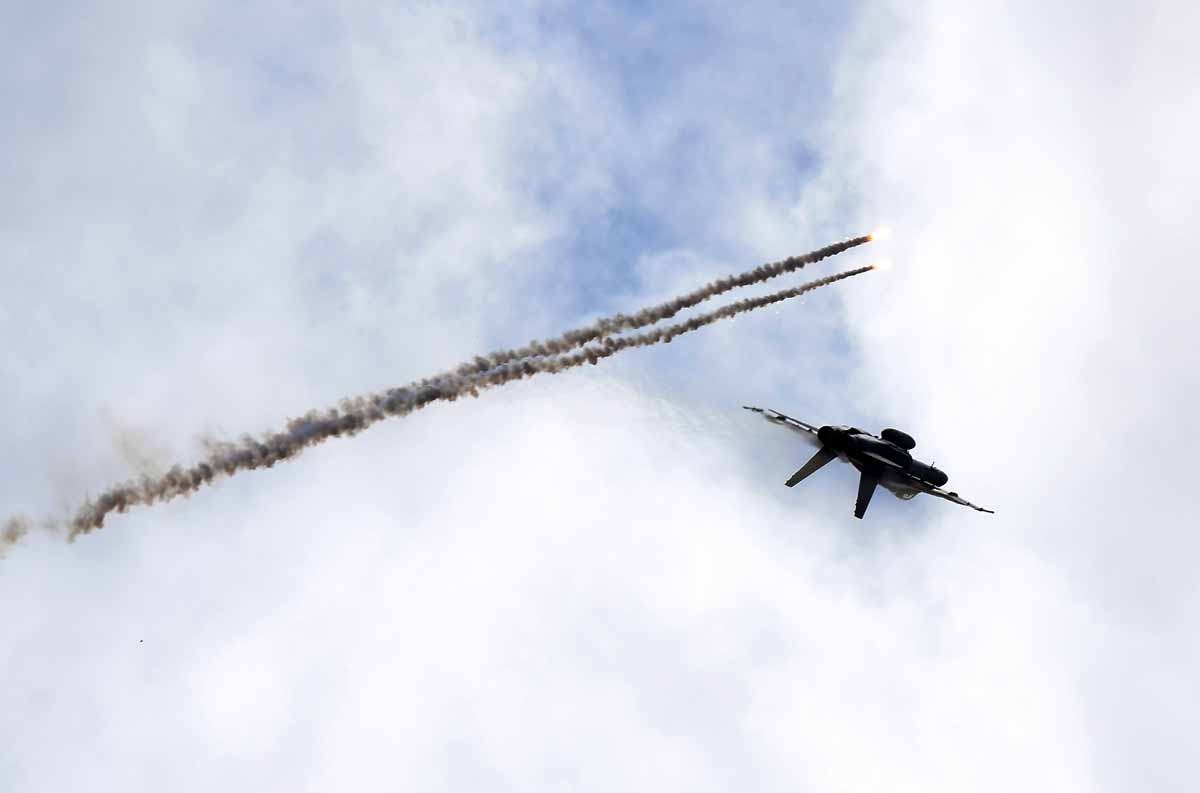 A Royal Australian Air Force F/A-18 Hornet aircraft launches flares in flight during the Australian International Airshow in Melbourne on March 5, 2017.