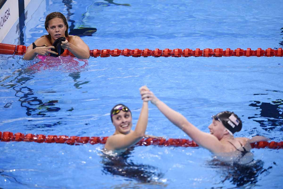 Russia's Yulia Efimova (L) looks on USA's Lilly King (R) celebrates winning the Women's 100m Breaststroke Final with USA's Katie Meili during the swimming event at the Rio 2016 Olympic Games at the Olympic Aquatics Stadium in Rio de Janeiro on August 8, 2 Russia's Yulia Efimova (L) looks on USA's Lilly King (R) celebrates winning the Women's 100m Breaststroke Final with USA's Katie Meili during the swimming event at the Rio 2016 Olympic Games at the Olympic Aquatics Stadium in Rio de Janeiro on August 8, 2