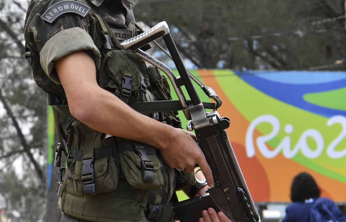 A Brasilian soldier stands guard near the Riocentro complex in Rio de Janeiro, on August 3, 2016, ahead of the Rio 2016 Olympic Games. A Brasilian soldier stands guard near the Riocentro complex in Rio de Janeiro, on August 3, 2016, ahead of the Rio 2016 Olympic Games.