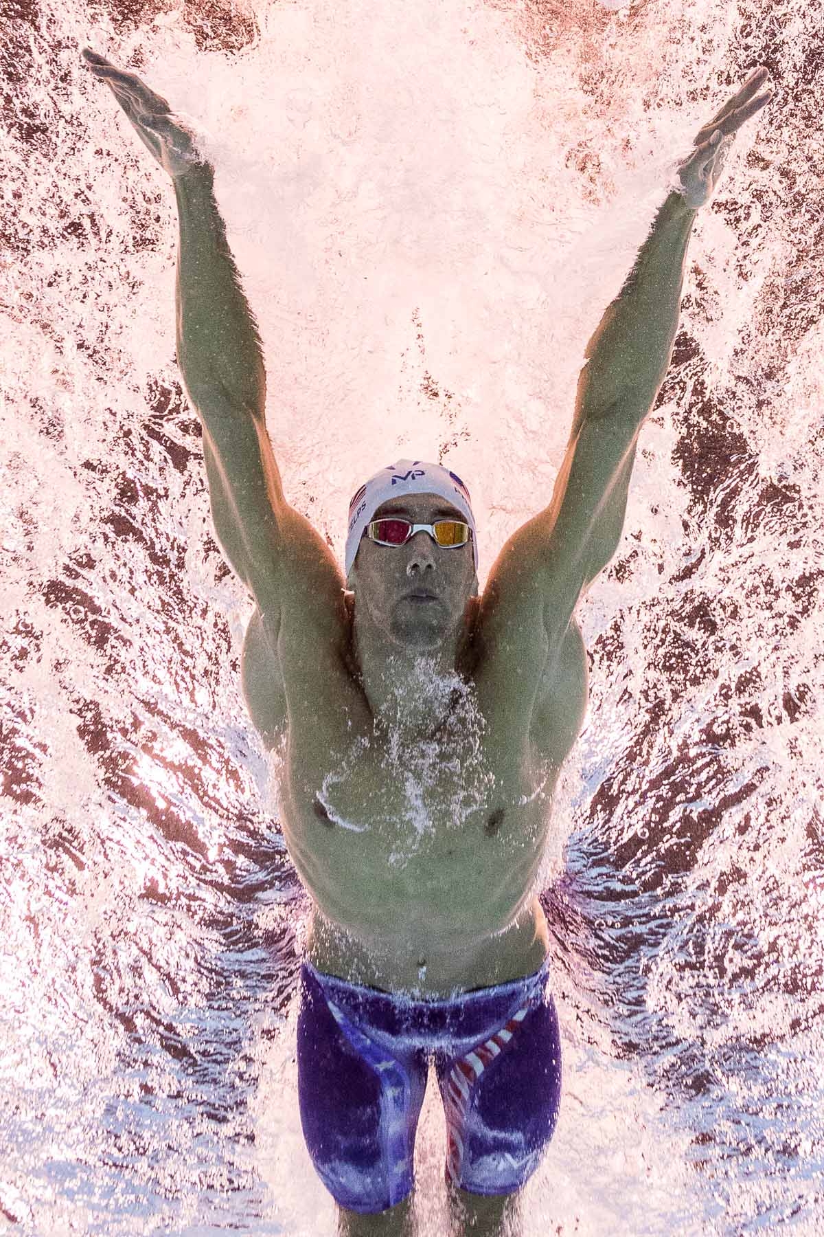 USA's Michael Phelps competes in a Men's 100m Butterfly heat during the swimming event at the Rio 2016 Olympic Games at the Olympic Aquatics Stadium in Rio de Janeiro on August 11, 2016. USA's Michael Phelps competes in a Men's 100m Butterfly heat during the swimming event at the Rio 2016 Olympic Games at the Olympic Aquatics Stadium in Rio de Janeiro on August 11, 2016.