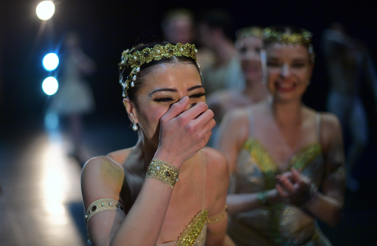 Ballet dancers react after performing on the opening night of a Ballet production at the Municipal Theater in Rio de Janeiro, Brazil on June 23, 2018.