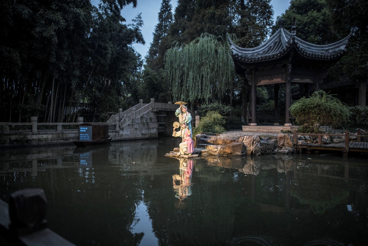 Chinese actors perform the outdoor Peking Opera in Zhujiajiao on the outskirts of Shanghai on September 10, 2016.