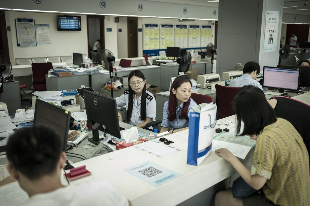 In this picture taken on September 13, 2016, state employees work at the taxation affairs department in Shanghai