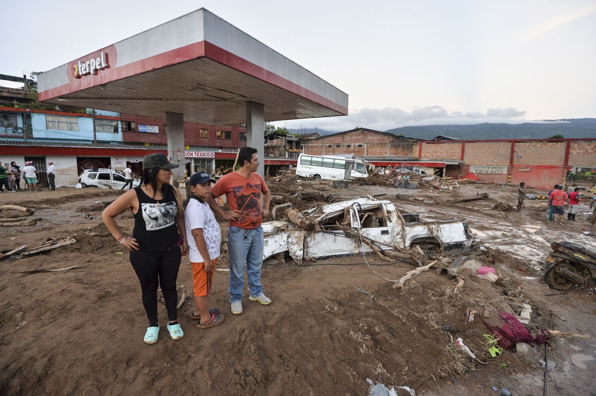 People look at the damage caused by mudslides following heavy rains in Mocoa, Putumayo department, southern Colombia on April 1, 2017.