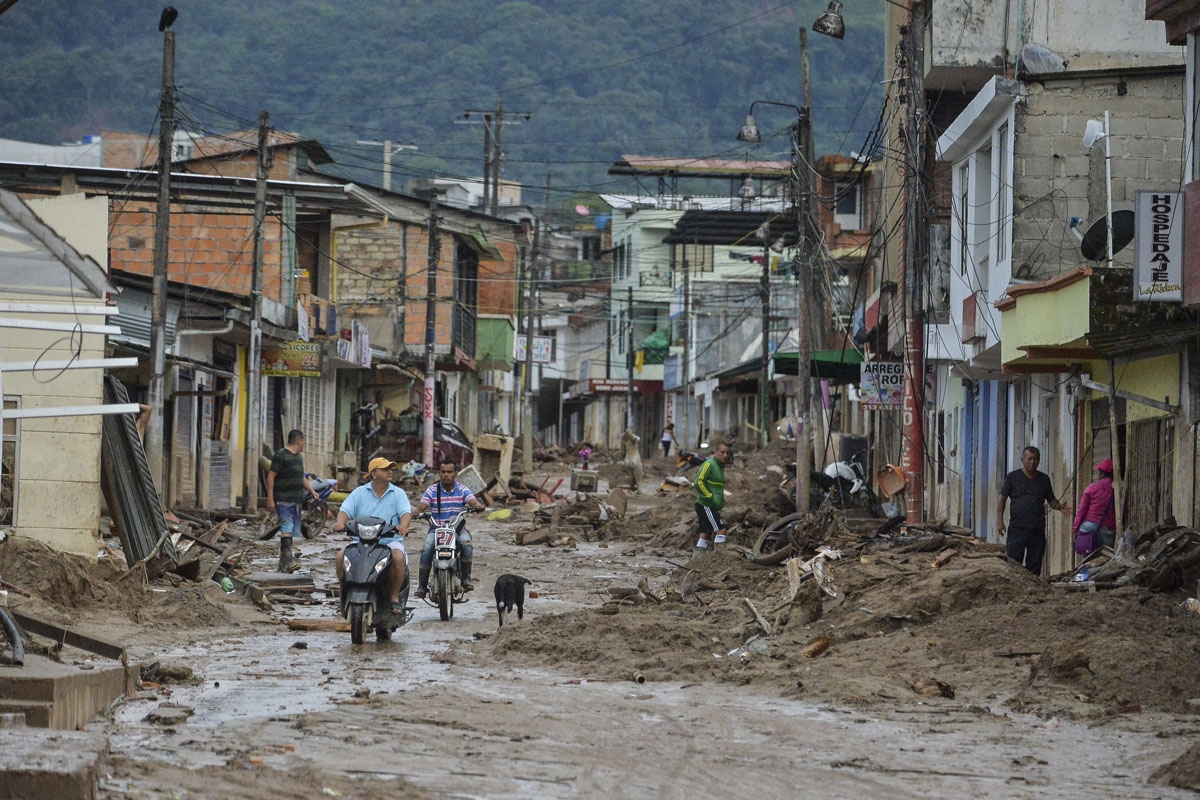 People look at the damage caused by mudslides following heavy rains in Mocoa, Putumayo department, southern Colombia on April 2, 2017.