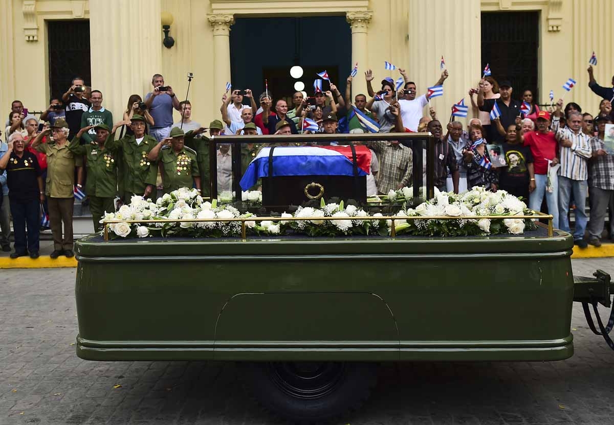 The urn with the ashes of Cuban leader Fidel Castro is driven through Santa Clara, Cuba, on December 1, 2016 during its four-day journey across the island for the burial in Santiago de Cuba. The urn with the ashes of Cuban leader Fidel Castro is driven through Santa Clara, Cuba, on December 1, 2016 during its four-day journey across the island for the burial in Santiago de Cuba.