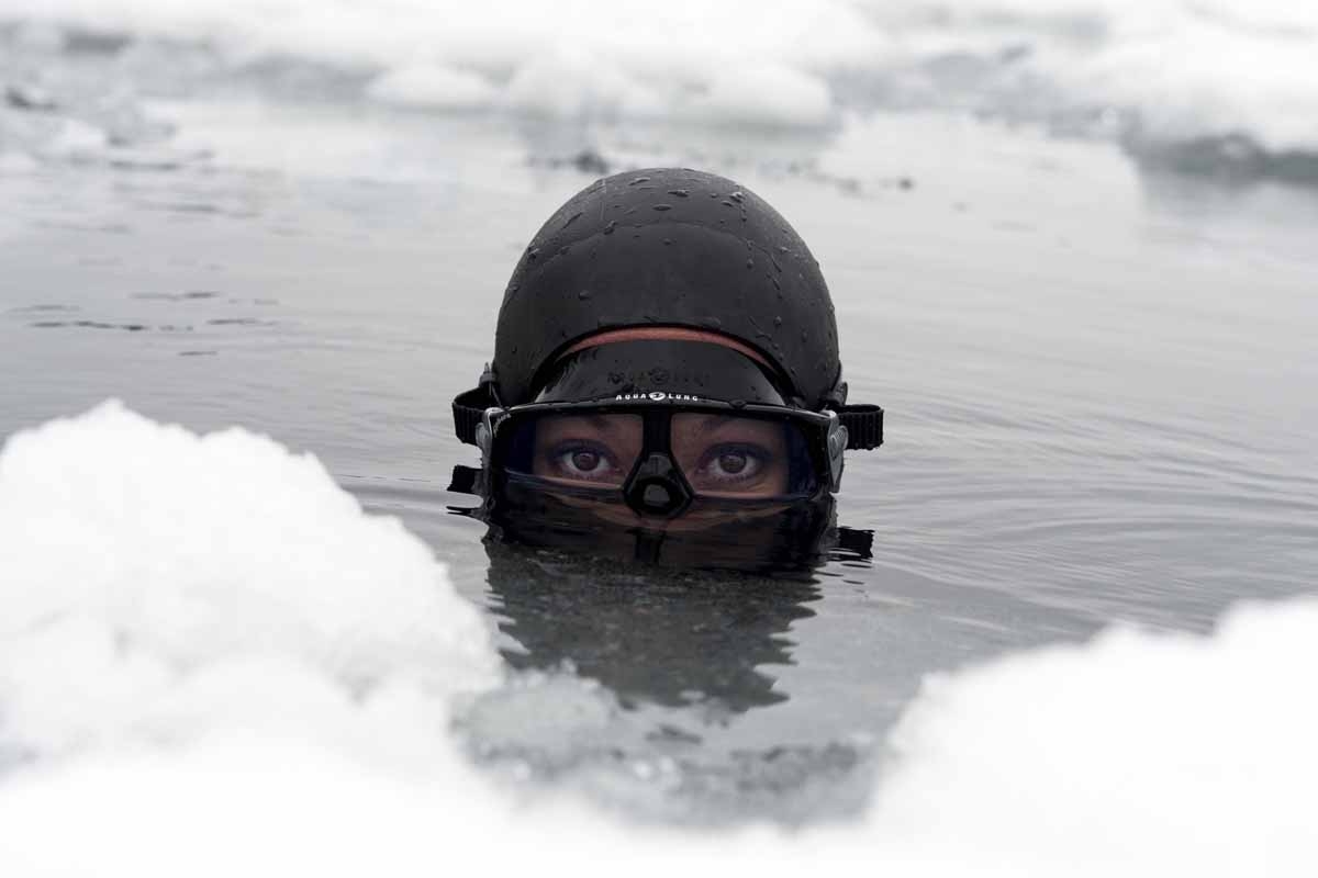 Johanna Nordblad, 42, Finnish freediver looks up from the water during a Ice-freediving training session on February 28, 2017, in Somero (southwest Finland)