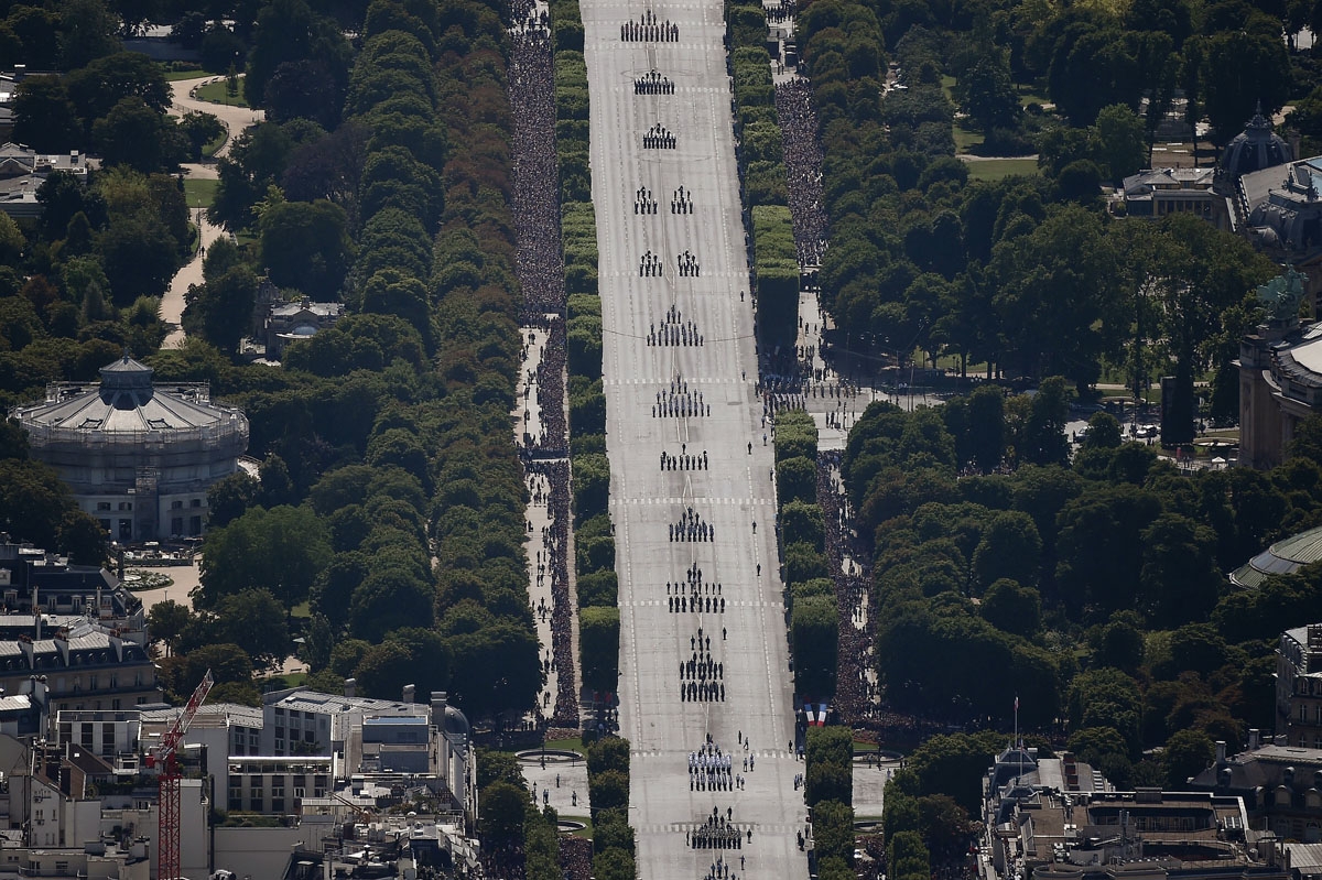 An aerial view shows the annual Bastille Day military parade on the Champs-Elysees avenue in Paris on July 14, 2017.
