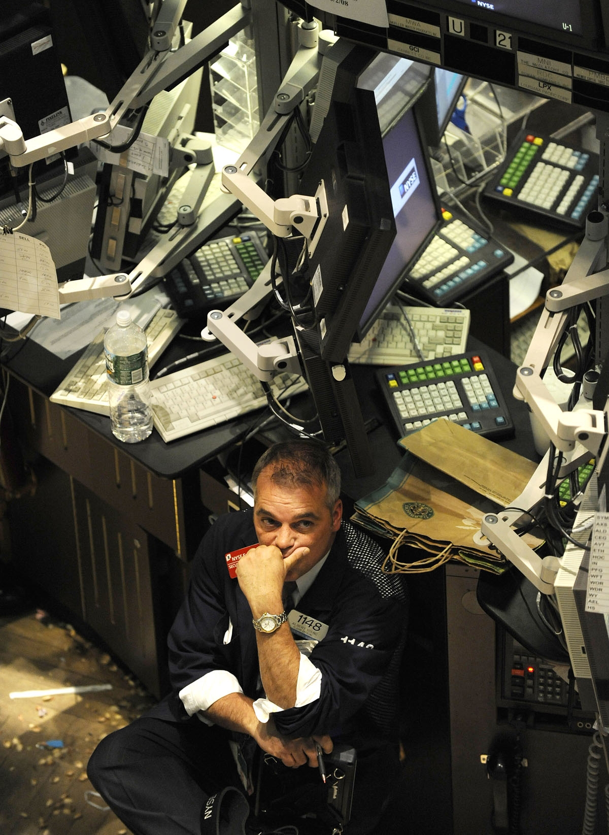 A trader looks at the closing numbers on the floor of the New York Stock Exchange October 6, 2008.