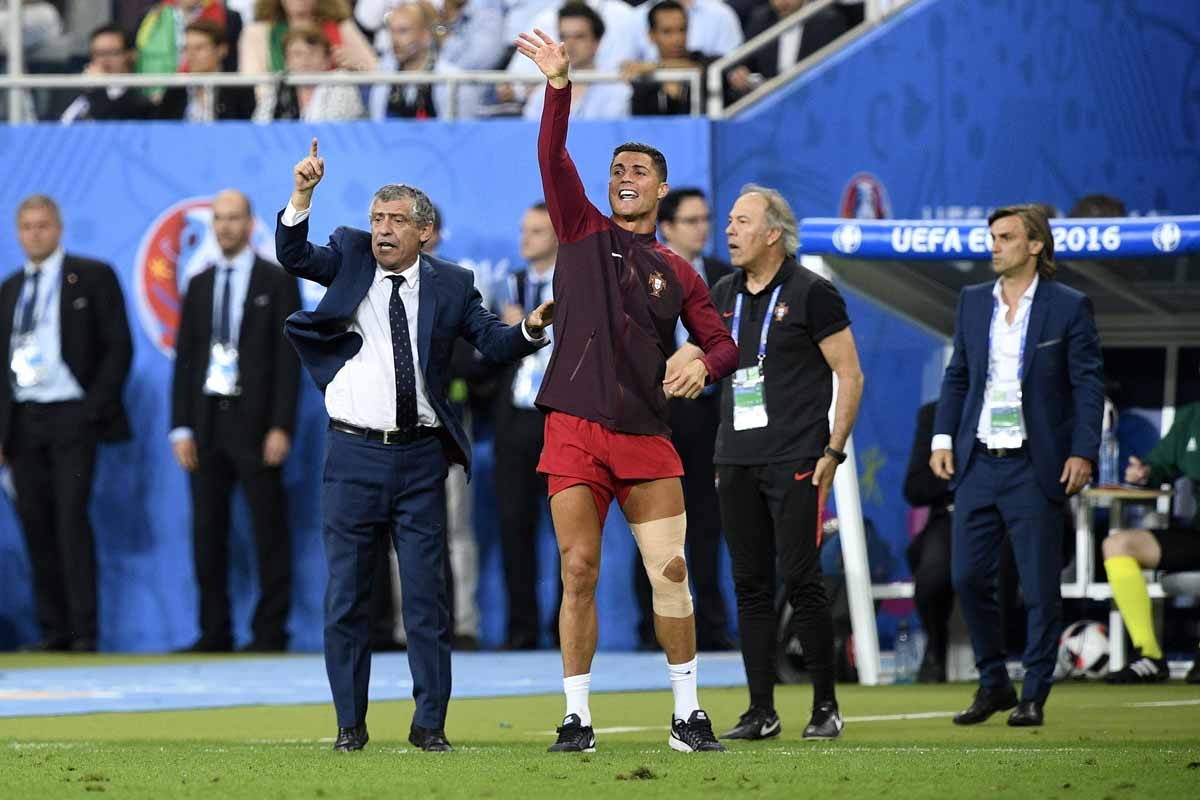 Portugal's coach Fernando Santos (L) and Portugal's forward Cristiano Ronaldo react during the last minutes of the Euro 2016 final football match between France and Portugal at the Stade de France in Saint-Denis, north of Paris, on July 10, 2016. Portugal Portugal's coach Fernando Santos (L) and Portugal's forward Cristiano Ronaldo react during the last minutes of the Euro 2016 final football match between France and Portugal at the Stade de France in Saint-Denis, north of Paris, on July 10, 2016. Portugal