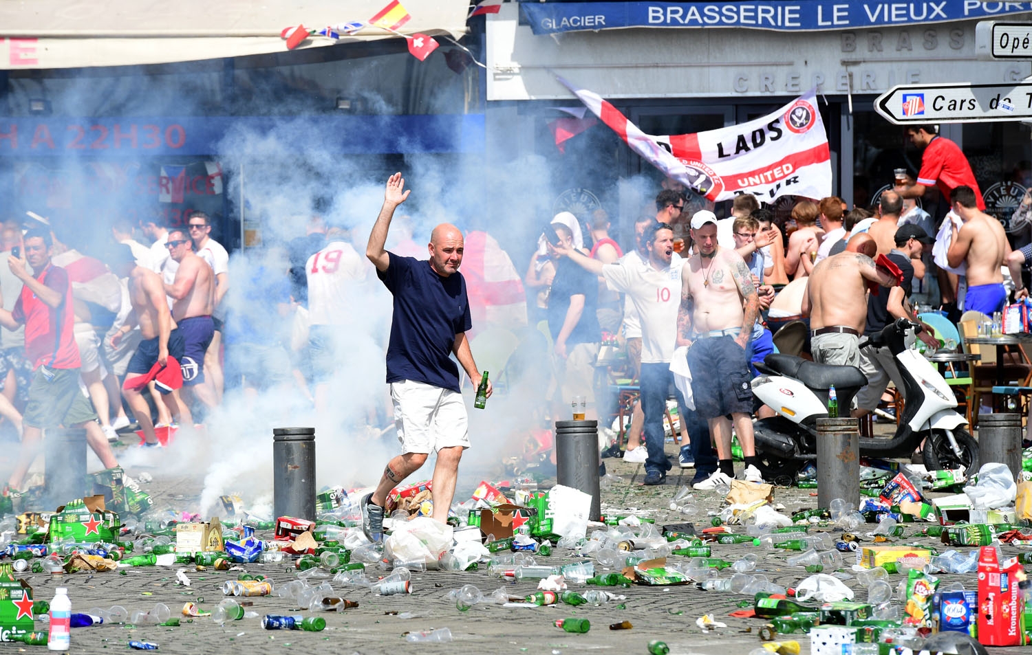 Tear gas is fired at England fans as they gather in the city of Marseille, southern France, on June 11, 2016