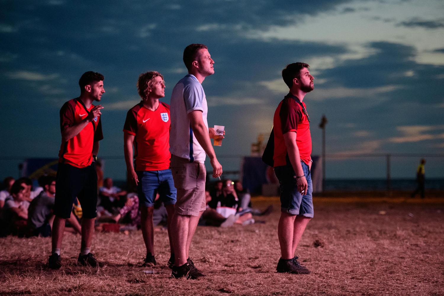 England supporters react as they watch the Euro 2016 group B football match between England and Russia from the fanzone in Marseille, on June 11, 2016