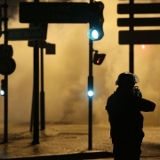 An anti riot policeman points his weapon in Bobigny, northern Paris, on February 16, 2017 during a demonstration to demand justice for Theo, a 22-year-old youth worker who required surgery after his arrest last week in the gritty suburb of Aulnay-sous-Boi