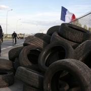 Prison wardens stand near tyres during a protest oustide the Fleury-Merogis prison called by several unions following an attack against six prison wardens, in Fleury-Merogis on April 10, 2017.