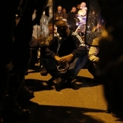 Protesters sit in front of security forces near the Fleury-Merogis prison, near Paris, on April 10, 2017, during a demonstration by prison guards after six of their colleagues were injured by inmates.