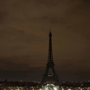 The lights of the Eiffel Tower are switched off at midnight in solidarity with the city of London following a terror attack on March 22, 2017.