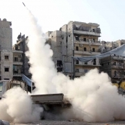 A homemade missile is launched towards the location of pro-regime fighters in the northern Syrian city of Aleppo on February 24, 2014.
