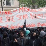 People hold a banner reading Against the ballot box misery, our joy will be nocturnal during a demonstration for a social first round of the French presidential election on April 22, 2017 on the place de la Republique in Paris.