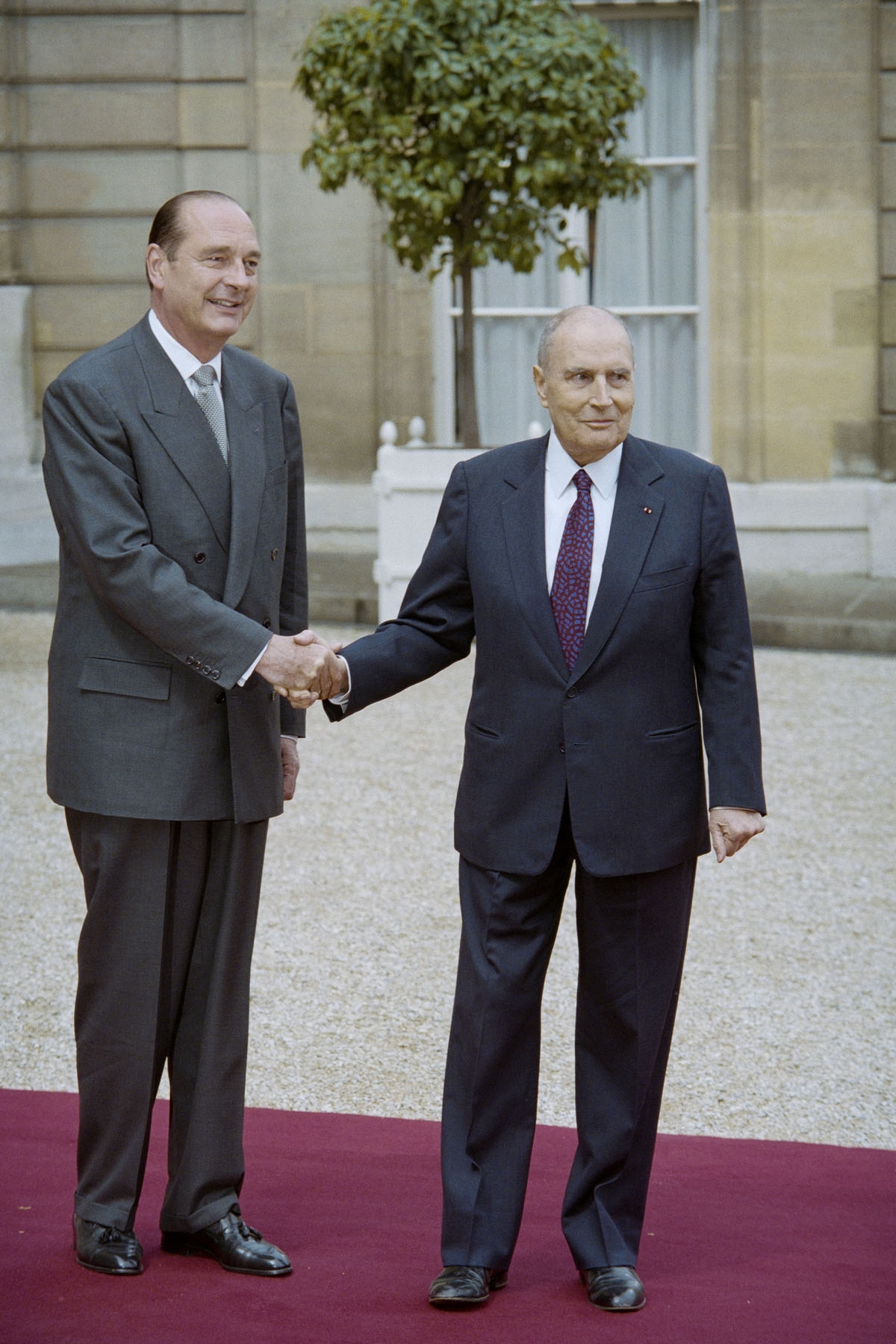 French outgoing President Francois Mitterrand (R) shakes hands with his successor Jacques Chirac during the formal handover of power ceremony on May 17, 1995 at the Elysee Palace in Paris.