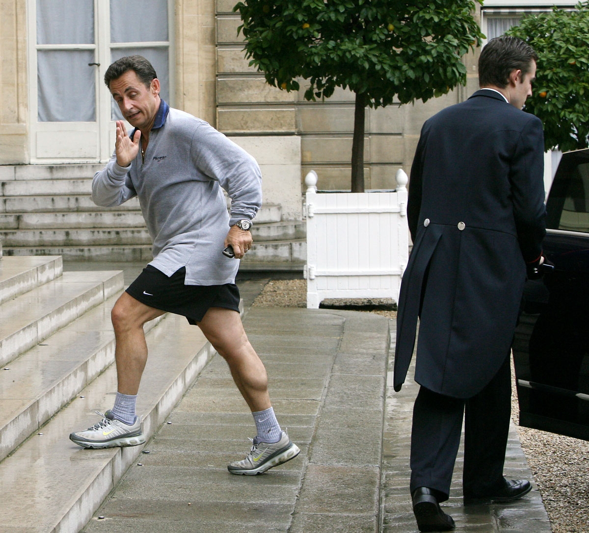 French president Niclas Sarkozy enters the Elysee palace after a jogging with Francois Fillon (not pictured), an hour after being appointed prime minister, 17 May 2007 in Paris.