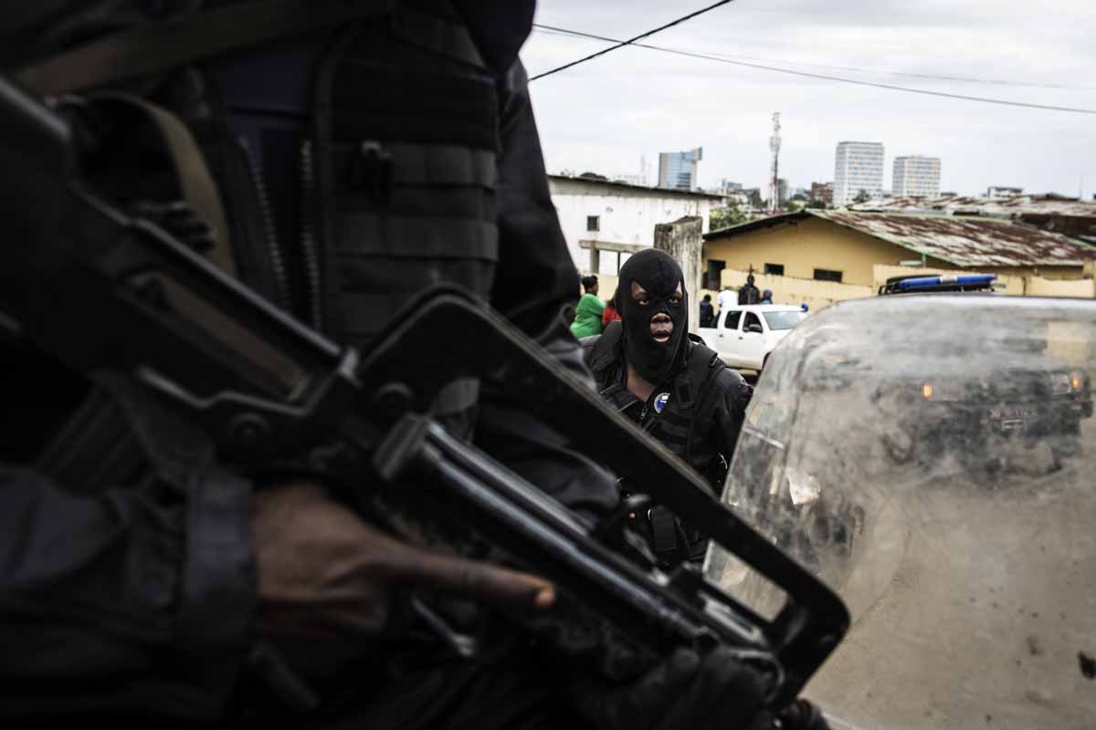 Gabonese police officers secure a neighbourhood in Libreville protecting civilians from looters on September 2, 2016. Gabonese police officers secure a neighbourhood in Libreville protecting civilians from looters on September 2, 2016.
