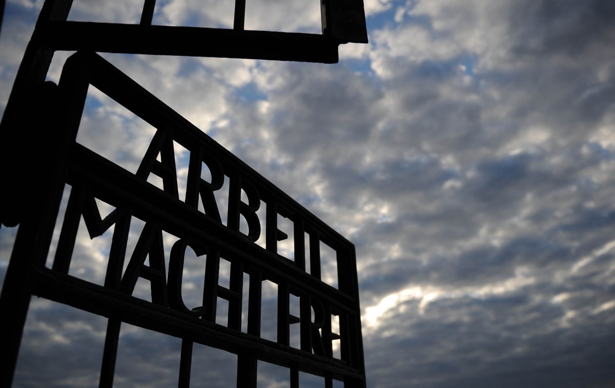 The writing Arbeit Macht Frei (Work Sets You Free) can be seen at the gate of Sachsenhausen concentration camp memorial on September 03, 2010 in Oranienburg, northeastern Germany. AFP PHOTO /