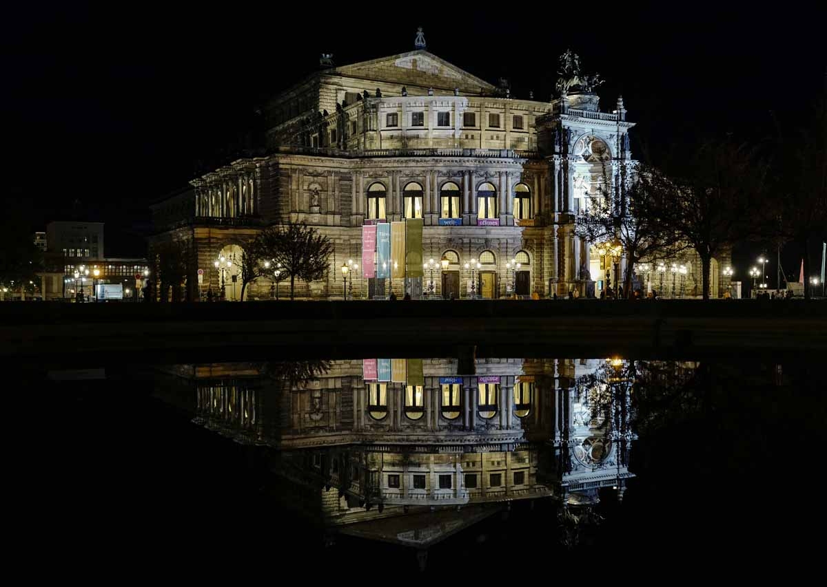 View of the Semperoper Opera house reflected in a foutain in Dresden by night taken on September 28, 2016. View of the Semperoper Opera house reflected in a foutain in Dresden by night taken on September 28, 2016.