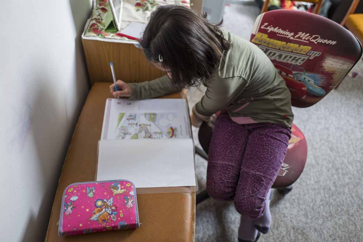 8-year-old Ghazal Deshli, a refugee from Syria, does her German homework at home in Clausnitz on September 28, 2016. 8-year-old Ghazal Deshli, a refugee from Syria, does her German homework at home in Clausnitz on September 28, 2016.