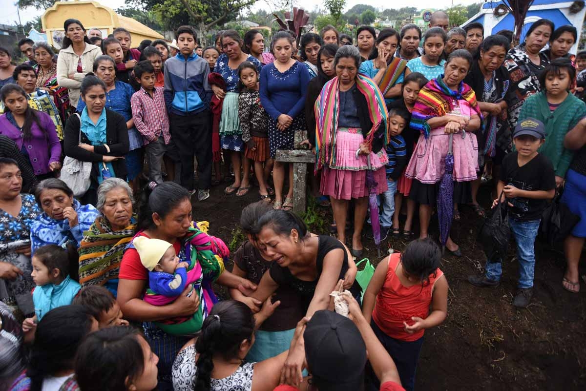 Relatives and residents attend a funeral of Erick Rivas, 20 year-old, who died following the eruption of the Fuego volcano, along the streets of Alotenango municipality, Sacatepequez, about 65 km southwest of Guatemala City, on June 6, 2018. Nearly 200 pe