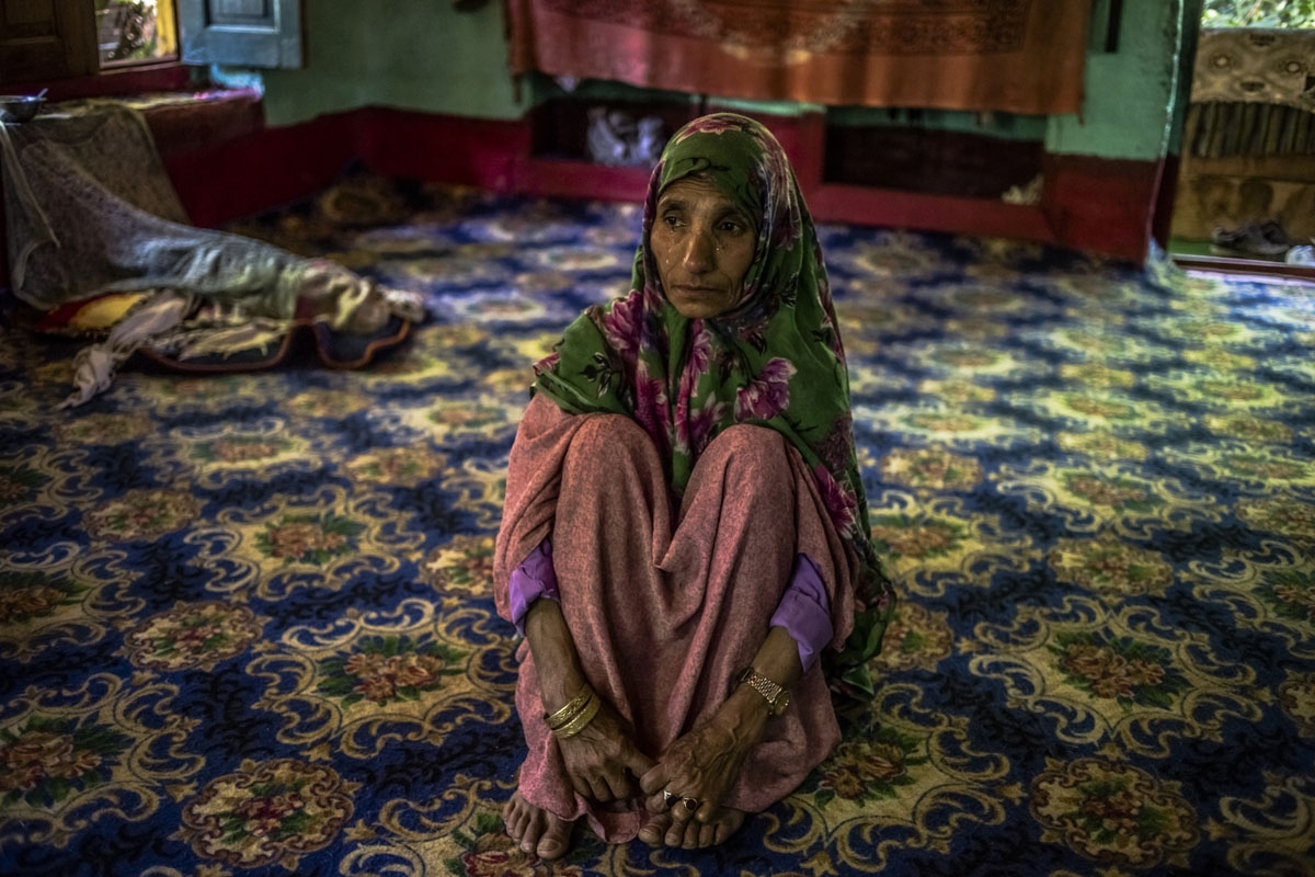 In this photo taken on June 29, 2016, Kashmiri mother Rahma Begum, who is unsure of her age, recounts the disappearance of her son Mir Ali, who went missing in 2003, one year after he married, at her home in Wantwoora Mohalla in Kandi in north Kashmir's K