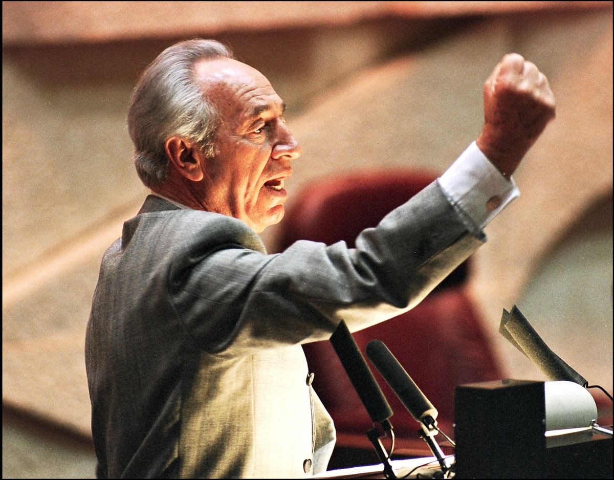 Israeli Foreign minister Shimon Peres raises his fist when reacting to opposition parliament members during a debate at the Knesset (parliament) 09 September 1993