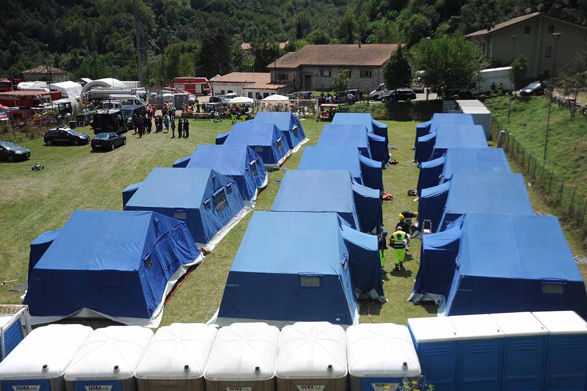 Tents of a temporary camp are installed at the central Italian village of Arquata del Tronto on August 25, 2016, a day after a 6.2-magnitude earthquake struck the region killing some 247 people. Tents of a temporary camp are installed at the central Italian village of Arquata del Tronto on August 25, 2016, a day after a 6.2-magnitude earthquake struck the region killing some 247 people.
