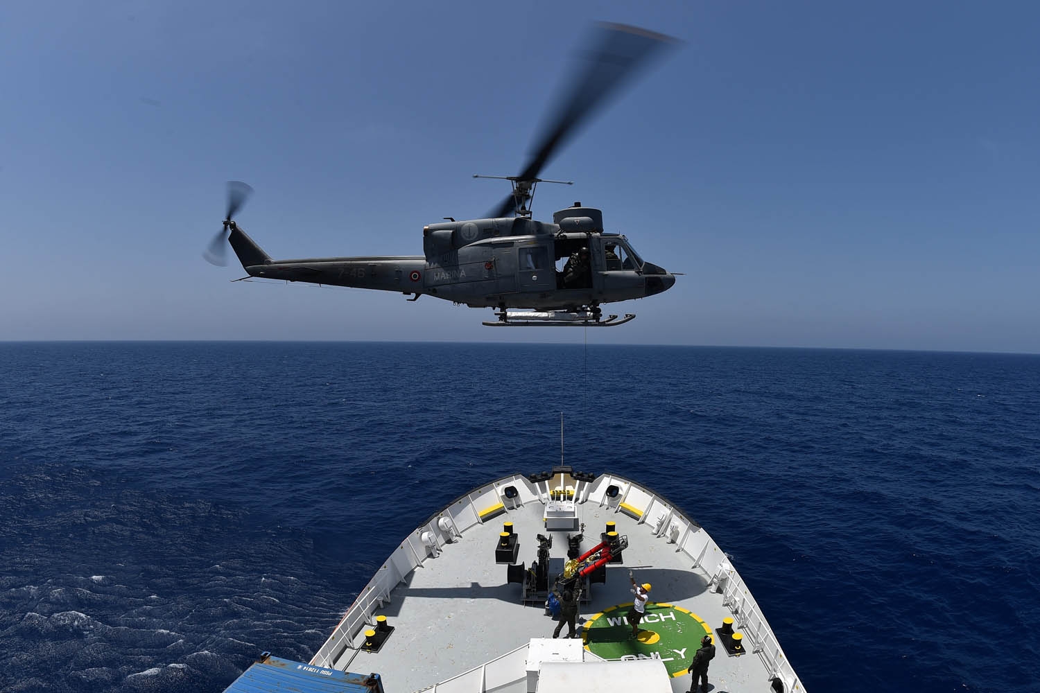 An helicopter from the Italian Marine evacuates a baby in emergency during a rescue operation with the Aquarius, a former North Atlantic fisheries protection ship now used by humanitarians SOS Mediterranee and Medecins Sans Frontieres (Doctors without Bo