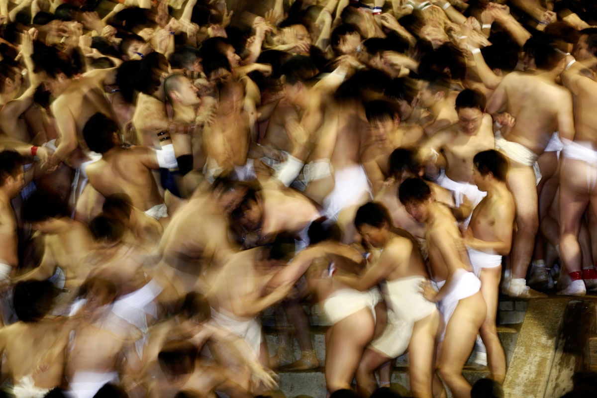 In this picture taken on February 18, 2017, worshippers push one another as they wait for the priest to throw the sacred batons during the annual Naked Man Festival or 'Hadaka Matsuri' at Saidaiji Temple in Okayama, western Japan.