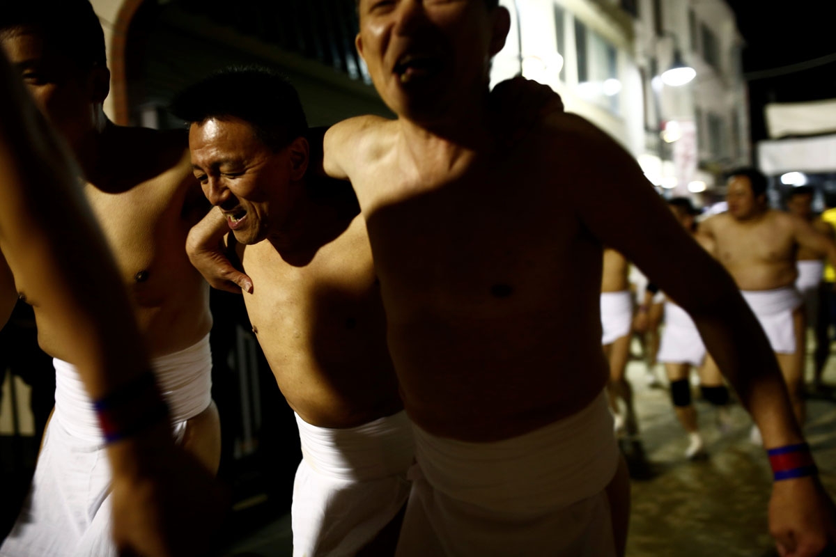 In this picture taken on February 18, 2017, worshippers walk towards Saidaiji Temple to attend the annual Naked Man Festival or 'Hadaka Matsuri' in Okayama, western Japan.