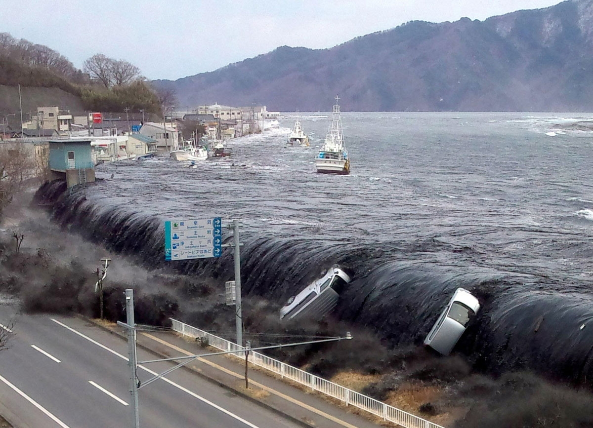 This picture taken by a Miyako City official on March 11, 2011 and released on March 18, 2011 shows a tsunami breeching an embankment and flowing into the city of Miyako in Iwate prefecture shortly after a 9.0 magnitude earthquake hit the region of northe