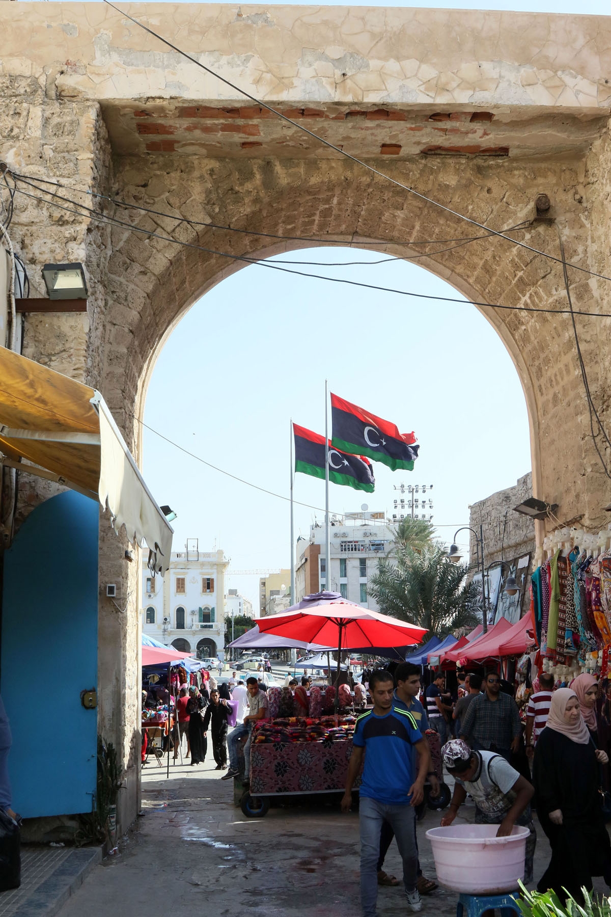Libyans shop at a market on Martyrs' square in the Libyan capital Tripoli on October 18, 2016.