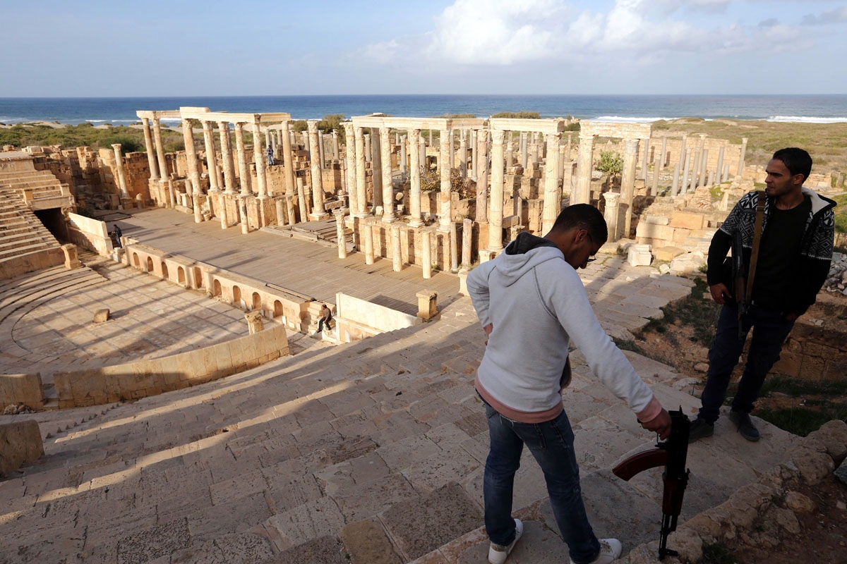 Armed men guard the amphitheatre in the ancient Roman city of Leptis Magna in al-Khums, 130 kms east of the Libyan capital Tripoli, on December 18, 2016.