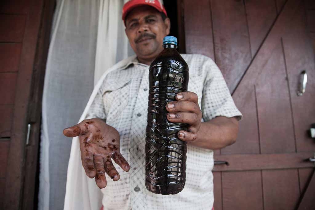 Vanilla farmer Thierry Tommy (L) presents a bottle of pure vanilla essential oil on May 25, 2016 in the municipality of Bemalamatra, 30 kms from Sambava, Madagascar. Vanilla farmer Thierry Tommy (L) presents a bottle of pure vanilla essential oil on May 25, 2016 in the municipality of Bemalamatra, 30 kms from Sambava, Madagascar.