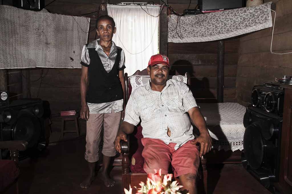 Thierry Tommy (R), a vanilla farmer owning about 5 hectares of vanilla plantations and produceing about 3 tons of green vanilla each year with 20 persons working for him, poses with his wife in their living room on May 25, 2016 in the Municipality Bemalam Thierry Tommy (R), a vanilla farmer owning about 5 hectares of vanilla plantations and produceing about 3 tons of green vanilla each year with 20 persons working for him, poses with his wife in their living room on May 25, 2016 in the Municipality Bemalam
