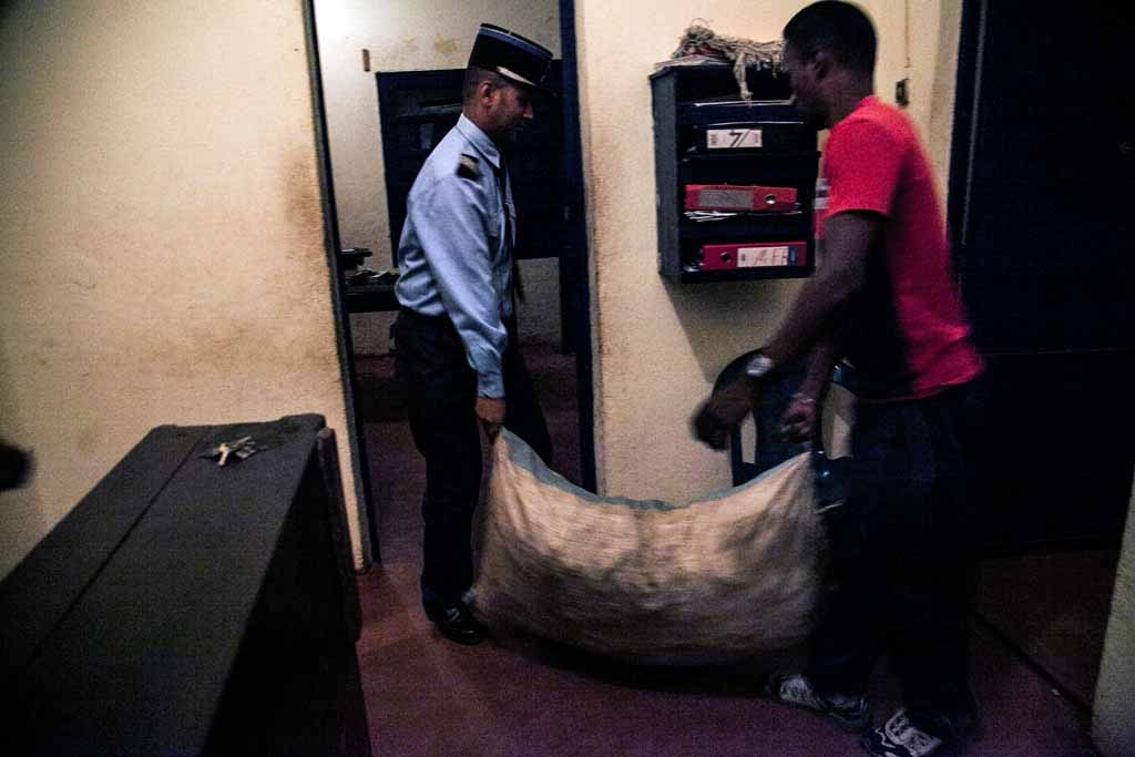 Policemen carry bags of vanilla as about 260 kg of green vanilla have been seized by gendarmerie and representative of Government, and stored at the Gendarmerie of Sambava on May 26, 2016 in Sambava, Madagascar. Policemen carry bags of vanilla as about 260 kg of green vanilla have been seized by gendarmerie and representative of Government, and stored at the Gendarmerie of Sambava on May 26, 2016 in Sambava, Madagascar.