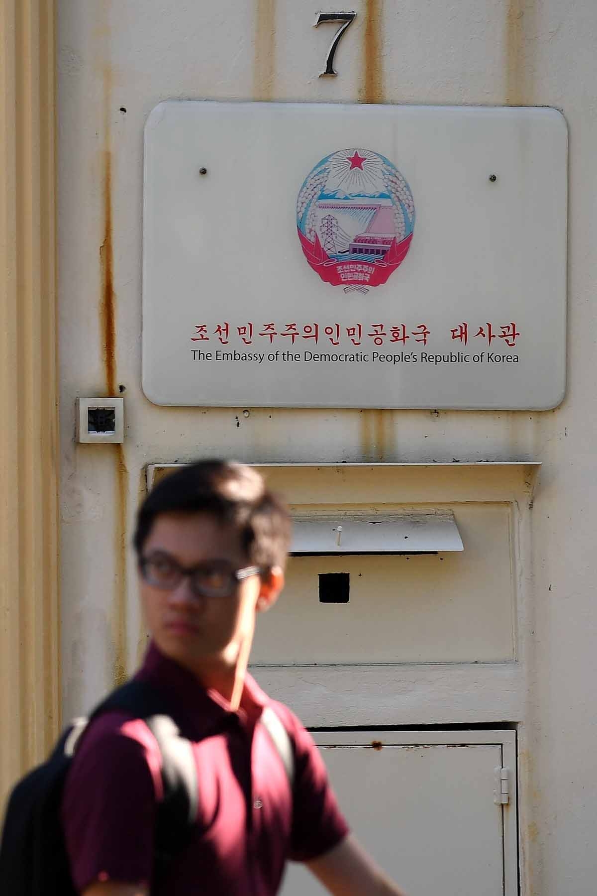 A man walks past the North Korean embassy in Kuala Lumpur on February 15, 2017, a day after it was reported that a North Korean man suspected to be Kim Jong-Nam, half-brother of North Korean leader Kim Jong-Un, had been assasinated.
