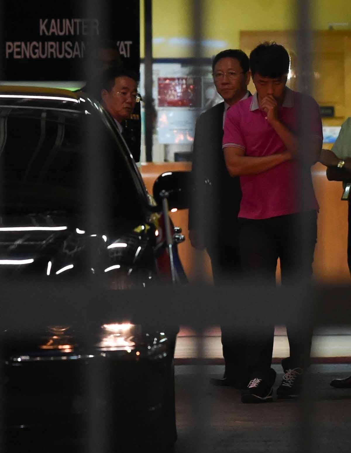 North Korean embassy officials leave the Forensic department where the body of a North Korean man suspected to be Kim Jong-Nam, half-brother of North Korean leader Kim Jong-Un, is bieng kept at the Hospital Kuala Lumpur in Kuala Lumpur on February 15, 201