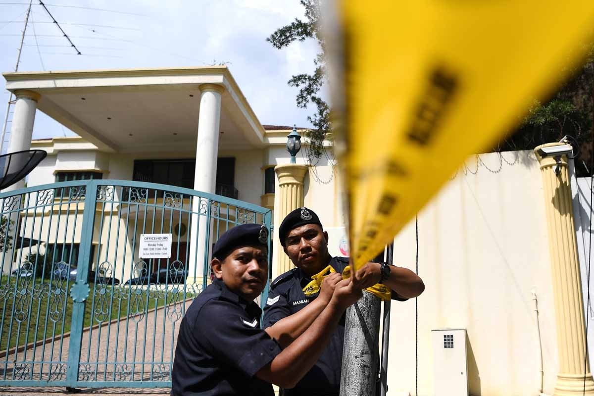 Malaysian police cordon off the area outside the North Korean Embassy in Kuala Lumpur on February 23, 2017 ahead of a protest by the United Malays National Organization (UMNO) Youth activists.