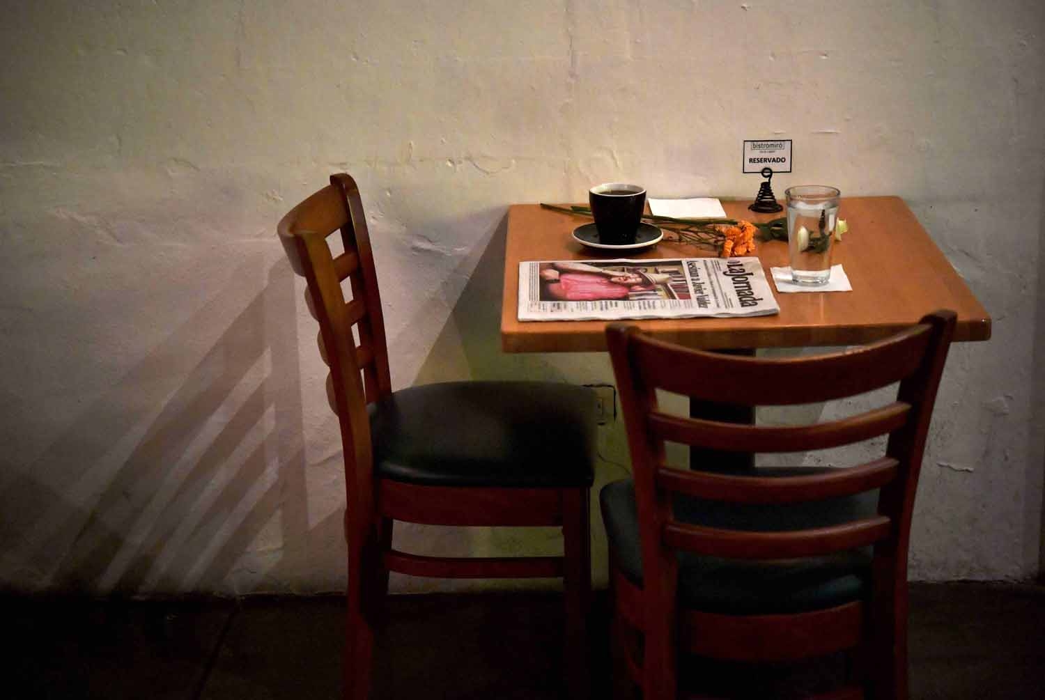 A makeshift altar with a cup of coffee, water glass and newspaper headlining the story of slain Mexican journalist Javier Valdez is pictured in a cafe previously frequented by Valdez in Culiacan, Sinaloa State, Mexico on May 16, 2017.