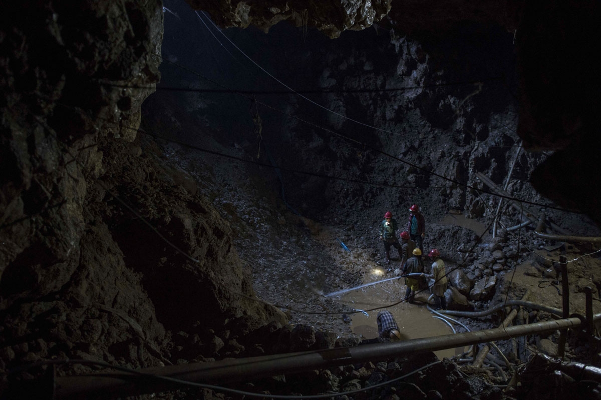 This photo taken on November 24, 2016 shows miners working inside a ruby mine in Mogok, north of Mandalay.