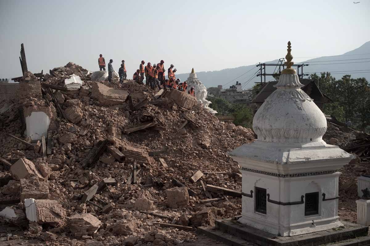 Nepalese Armed Police Force clear rubble at the Narayan temple in Kathmandu on May 1, 2015, following a 7.8 magnitude earthquake which struck the Himalayan nation on April 25. Nepalese Armed Police Force clear rubble at the Narayan temple in Kathmandu on May 1, 2015, following a 7.8 magnitude earthquake which struck the Himalayan nation on April 25.